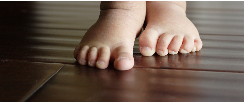 first steps page - baby feet taking their first steps