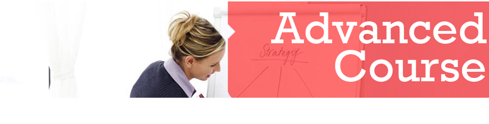 female trader outlining a trading strategy on a white board advanced trader course image